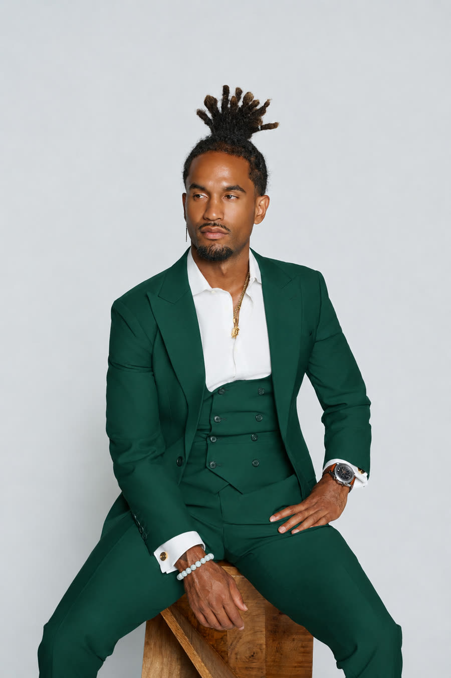 Michael Cortez, founder of In The Ecosystem with Mike, in a green suit